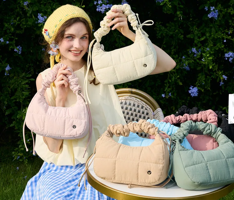 Pastel quilted bags on a garden table